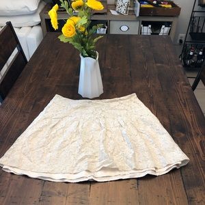 Beige lace skirt.